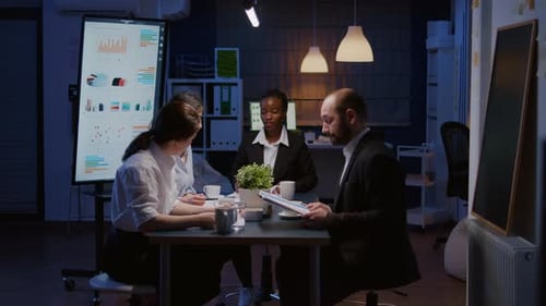 Diverse Professionals Collaborate at Conference Table