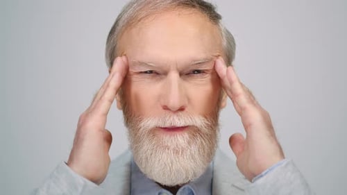 Old Man Thinking in Studio