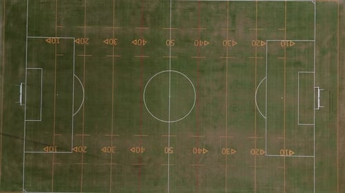 Ascending top down reveals the footbal, soccer, rugby field