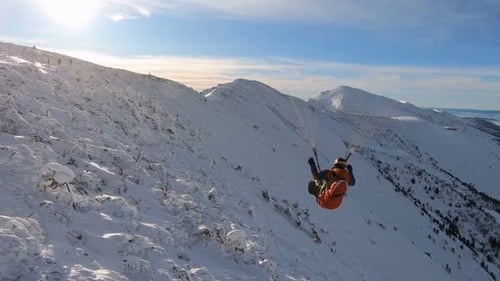 Proximity Paragliding Flight over Snowy Alpine Mountains, Freedom Adrenaline Adventure