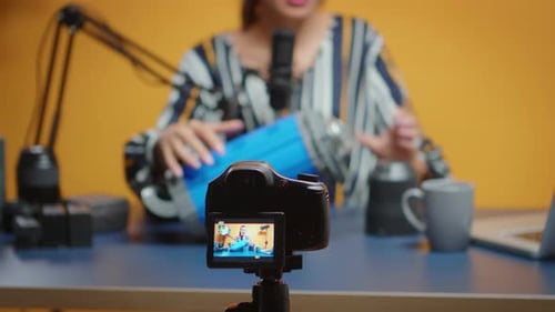 Woman Recording Product Review On Camera