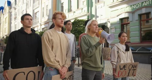 Group of Young Adults Protesting on City Street