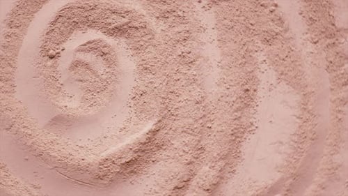 Swirling Abstract Tan Powder Close Up
