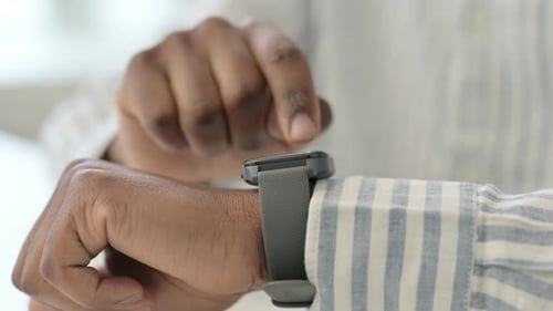 Hands Close Up of African Man Using Smart Watch