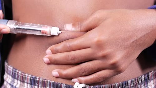Young Man Hand Using Insulin Pen Close Up