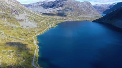 Scenic road in a Beautiful Valley with stunning views and lake, Aerial
