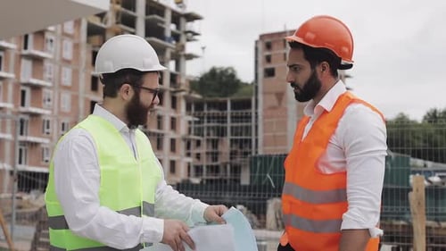 The Builder and Architect Man Are Discussing the Construction Plan of the Modern Business Center