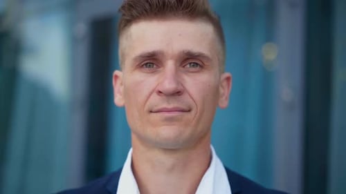 Smiling Confident Man Standing In Front of Office