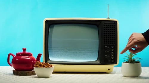 Retro Television with Static and Teapot Still Life