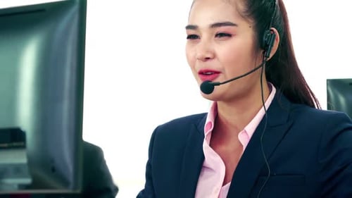 Business People Wearing Headset Working in Office