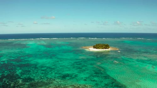 Tropical Guyam Island with a Sandy Beach and Tourists