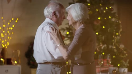Elderly Couple Dancing Together at Christmas
