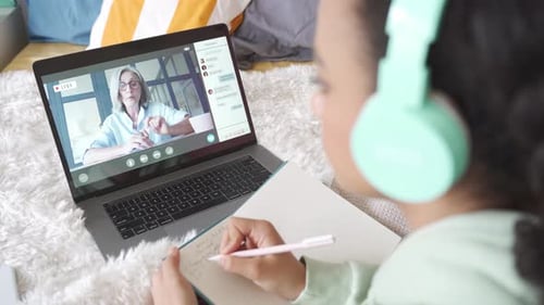 African Teen School Girl Distance Learning During Online Class with Teacher