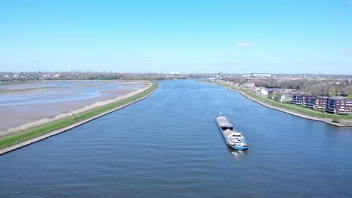 Aerial View Of Barge At Noord River Under Bright Blue Sky At Daytime Near Hendrik-Ido-Ambacht, Nethe