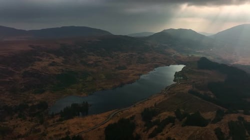 Looscaunagh Lough, Killarney, Kerry, Ireland, March 2022. Drone pulls northeast over the rugged land