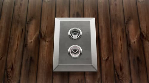 Chrome elevator up-down buttons on a vintage wooden wall in the office. 4KHD