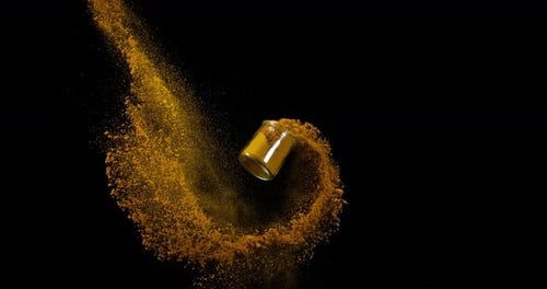 Curry Powder falling against Black Background, Slow motion 4K