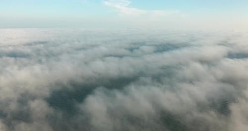 Aerial View Above Clouds and Ocean Waves