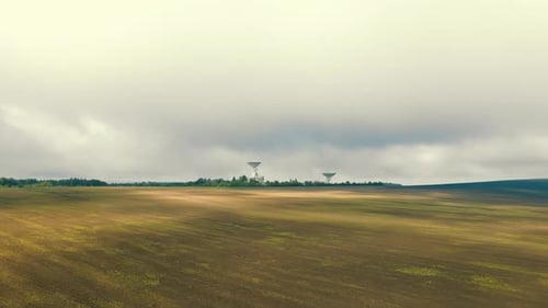 Aerial View of Field With Satellite Dishes