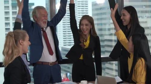 Successful Business Team Celebrating Together in a Modern Office