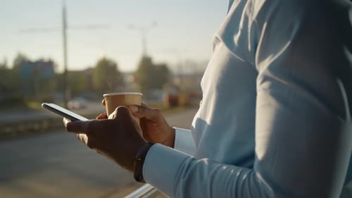 Close Up African American Young Attractive Man Using Phone on Street Sunlight Sunset Cellphone
