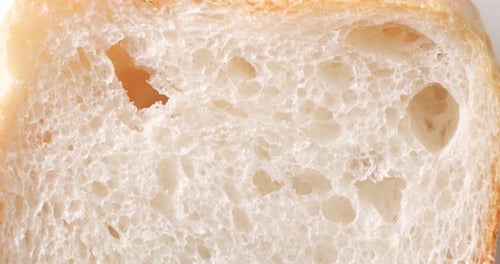 Finger Pokes Soft Slice of Bread