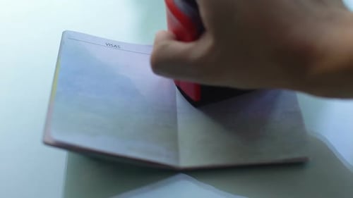 Passport Getting Stamped for Travel Visa