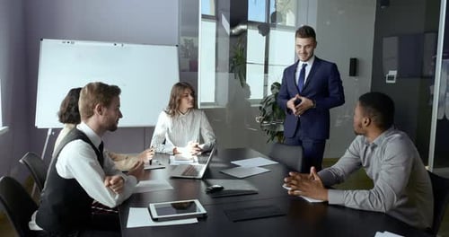 Business Meeting in Office with Presentation