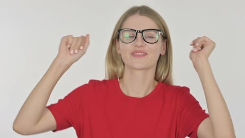Woman with Glasses Dancing on a Plain Background
