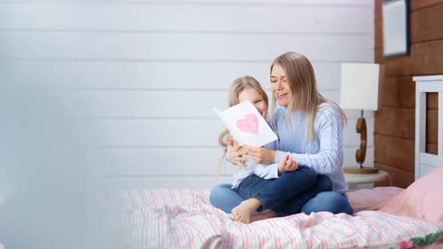 Blond Mother and Child Enjoying Card