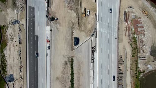 Aerial View of Highway Bridge Construction Over Small River