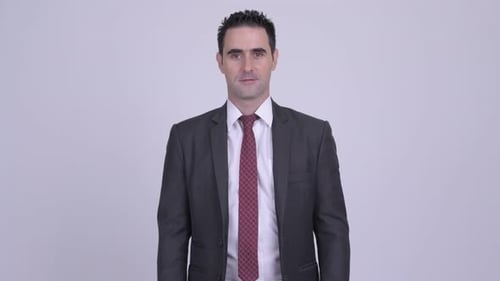 Smiling Businessman in Dark Suit and Red Tie