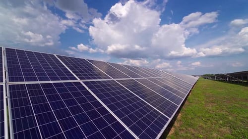 Solar panels on the grass. Solar panel electricity station for renewable green energy in summer.