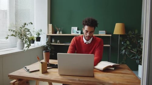 Young Mixed Race Man Discussing Business on Online Call