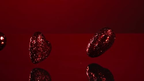 Decorations falling, bouncing in ultra slow mo 1500fps - reflective surface - VALENTINES PHANTOM 008