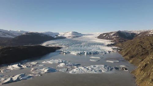 Drone Towards Landscape Towards Lake Of Ice Formations And Glacier