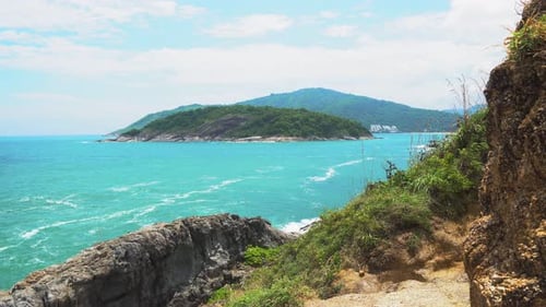 Beautiful Seascape. Tropical Island in The Lagoon. Waves Beat Against Stones