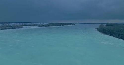 Drone Flies Over a Wide Frozen River Beautiful Patterns on the Ice