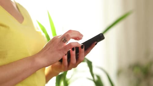 Close Up of Hand Using Smartphone Device