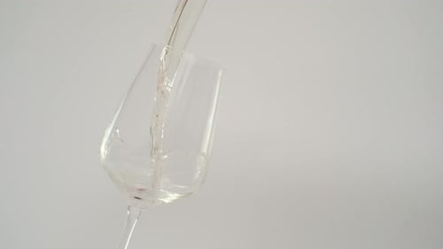 Slow Motion of Pouring White Wine in Tilted Glass , 1000 fps