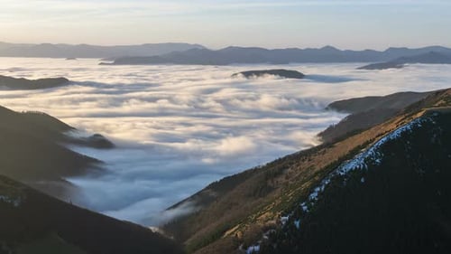 Aerial View of Misty Mountain Valley at Sunrise