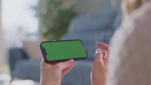 Woman using Chroma Key Smartphone