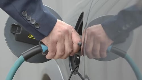 Electric Car Charger Plug Being Removed