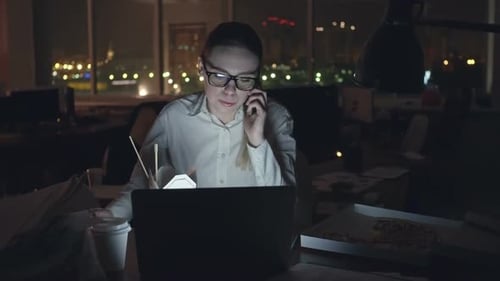 Businesswoman Spending Night at Office