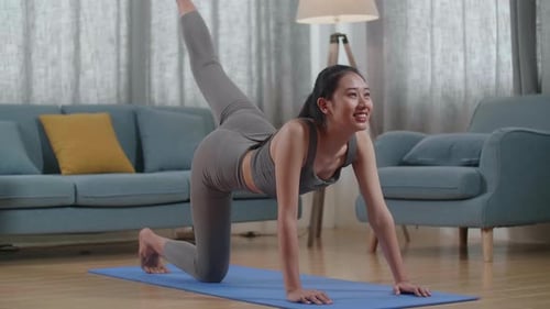 Asian Athletic Female Exercising, Stretching And Practising Yoga At Home. Healthy Lifestyle, Fitness