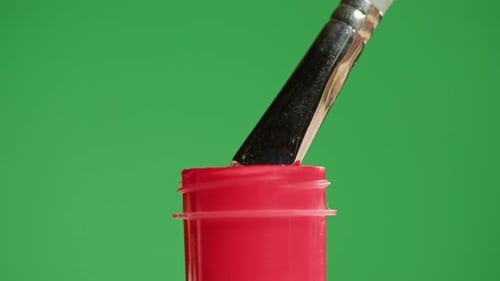 Red Paint Isolated on Green Background