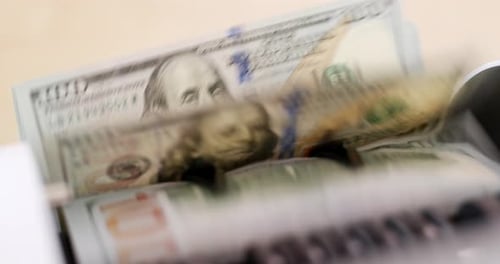 America banknote on automatic counting machine