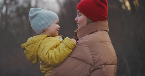 Loving Mother Holding Child Close Outside