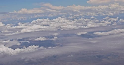 Cloudscape View on Airplane in Many Cloud Fantastic Blue Sky