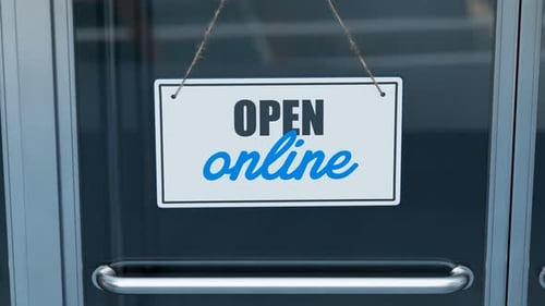 Das Geschäft wurde aufgrund von COVID-19 geschlossen. Online öffnen. Schild an der Glastür.